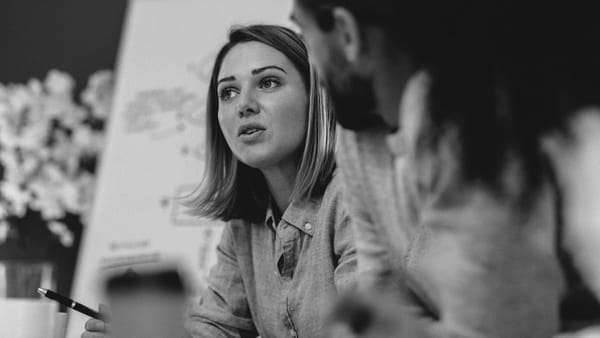 Childcare workers discuss work health and safety protocols in the workplace.