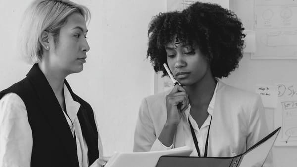 Team members in the workplace consider the role of mental health in work health and safety (WHS).